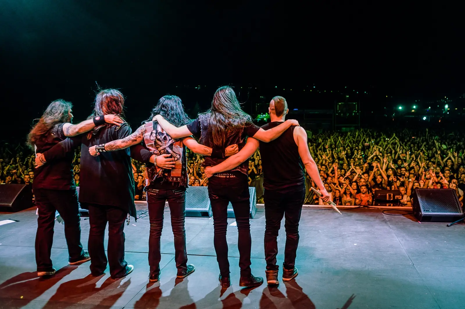 Band taking a bow facing the crowd